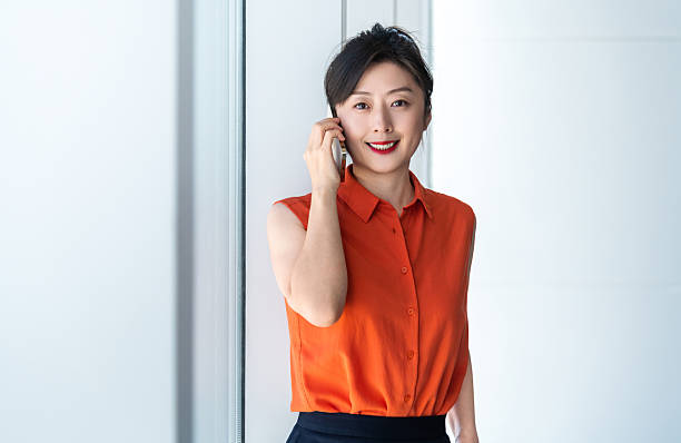 istock Businesswoman using smart phone near the window 2221723665