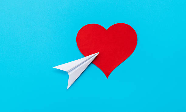 istock Paper airplane fly to red heart shape 2221725162