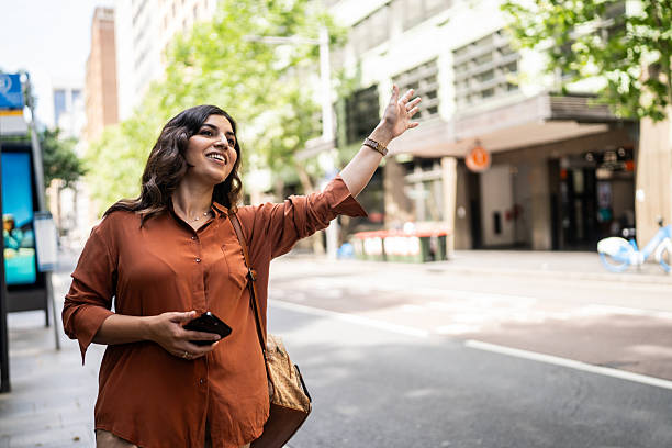 istock Woman Catching a Cab in Sydney’s Central Business District 2221729527