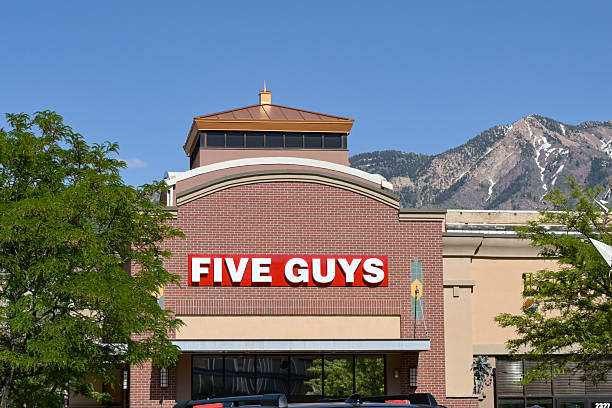 Ogden, Utah, USA - 26 May 2025: Exterior view of the Five Guys burger restaurant in downtown Ogden.