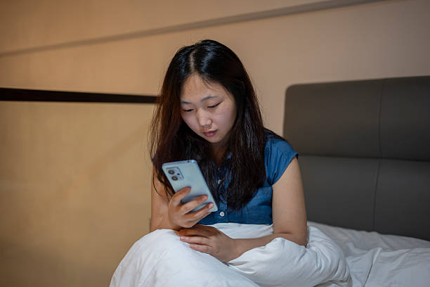 istock Women using mobile phones at home 2221741546