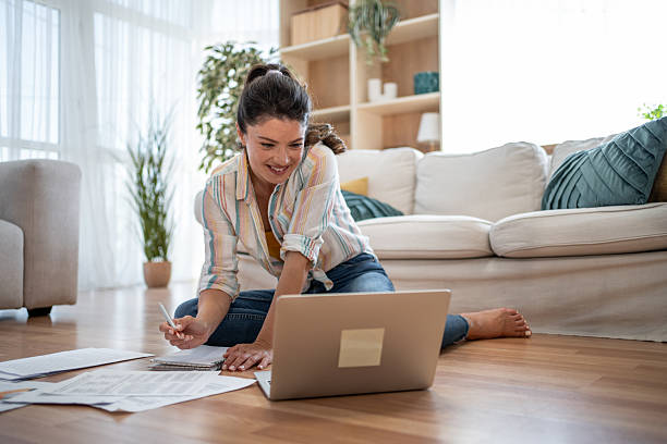 istock Young woman working from home having a video call on her laptop 2221743122