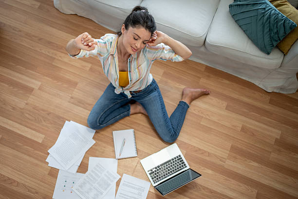 istock Young woman stretching after working from home 2221743202