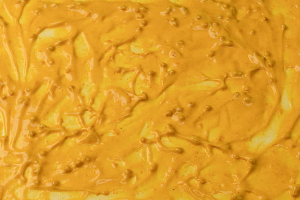 istock Yellow sauce splashes as a background. 2221753309