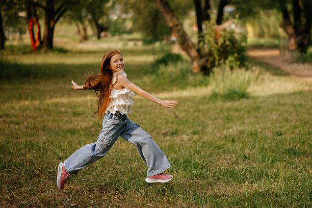 istock Joyful Child Running Freely in Nature 2221753956
