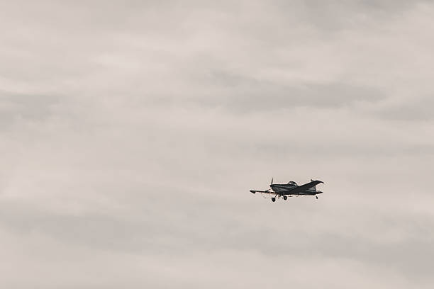 istock Glider-style plane flying in a cloudy sky. 2221770471