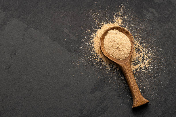 istock Organic Peruvian maca powder in spoon - Lepidium meyenii 2221771250