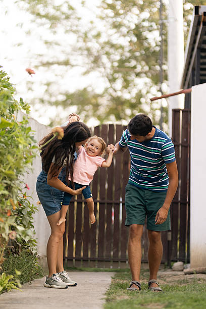 istock Happy family spending quality time together outdoors in their backyard 2221773590