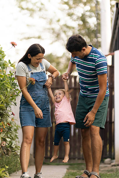 istock Happy family outdoors playing with their young child 2221773591