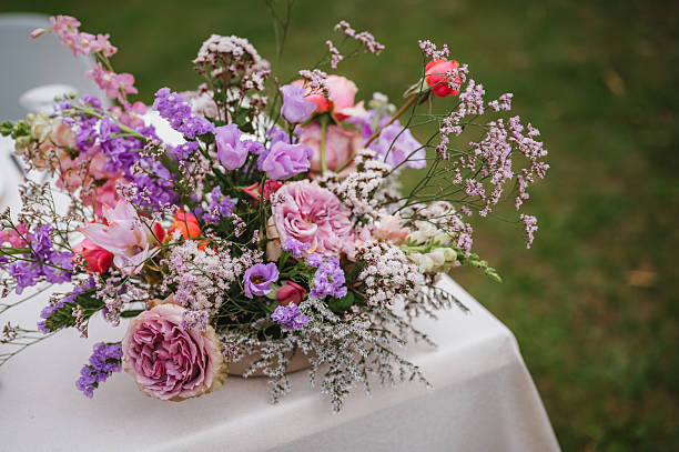 istock Wedding table with fresh flowers decoration. Forest / Elopement wedding 2221774525