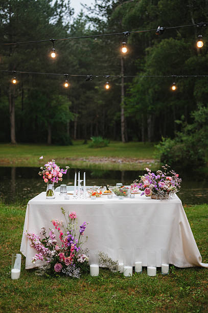 istock Wedding table with fresh flowers decoration. Forest / Elopement wedding 2221774535
