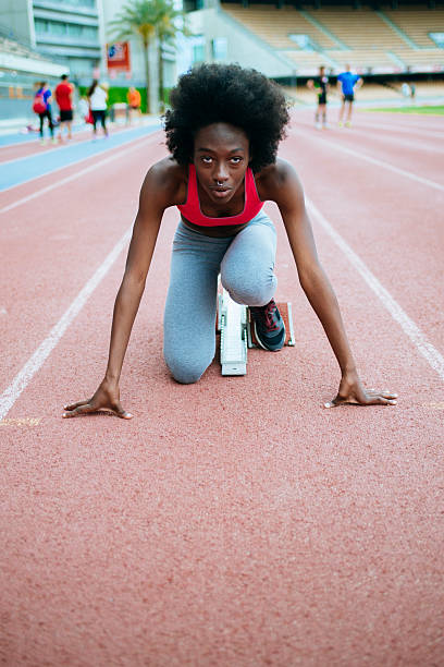 istock Determined female athlete preparing for race on track 2221775597