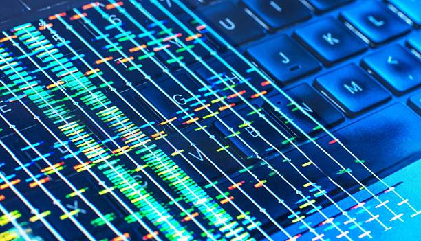 istock A close-up image displaying a laptop keyboard with DNA streams overlay. 2221782575
