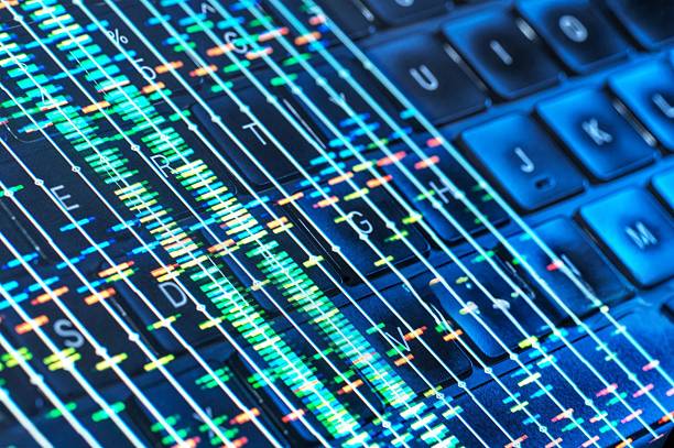 istock A close-up image displaying a laptop keyboard with DNA streams overlay. 2221782652