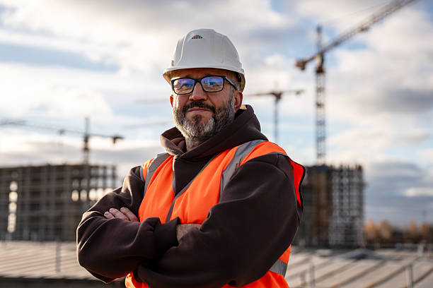 istock Confident Construction Worker in Hard Hat at Building Site 2221793638