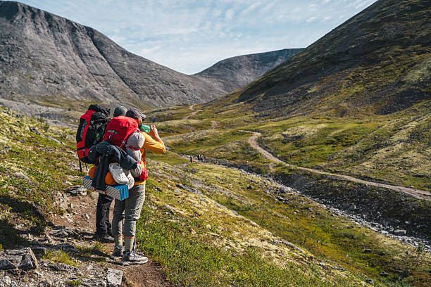 istock Backpackers Exploring a Scenic Mountain Valley During Daytime 2221794112