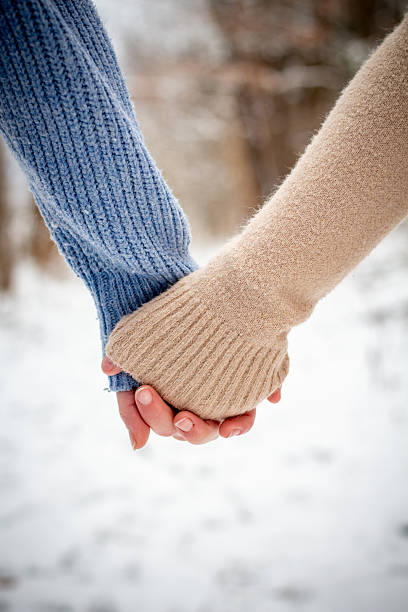 istock Mother/Daughter holding hands on a walk during a snow day 2221795051