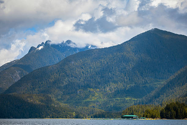 Scenic shorelines of Clayoquot Sound, with a fish farm in the distance. A popular wilderness destination for locals and visitors.