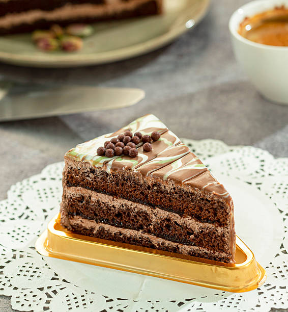 istock Chocolate cake with rich cream layers, presented on a light background. 2221798141