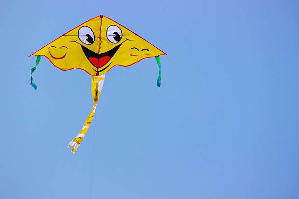 The kite is flying high above in the clear blue sky. It is a delightful and pleasant thing to rest upon. People celebrate the function of kite flying during some festivals.
