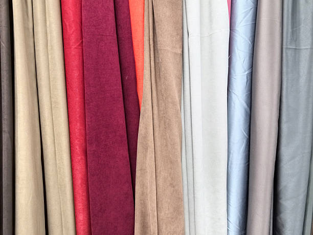 istock Colorful fabric rolls create a vibrant textile showcase in a marketplace 2221803291