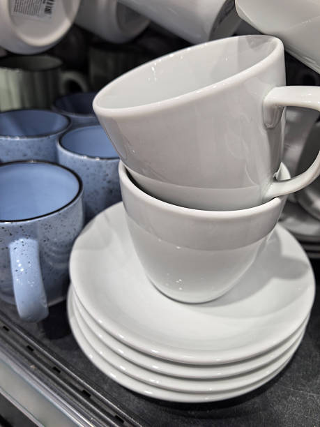 istock Stacked white cups and saucers in a cozy kitchen display 2221803294