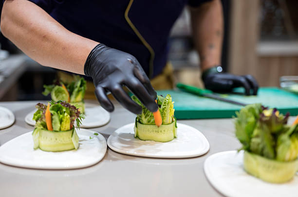 istock Cook preparing salad plates in a luxury restaurant kitchen 2221803346