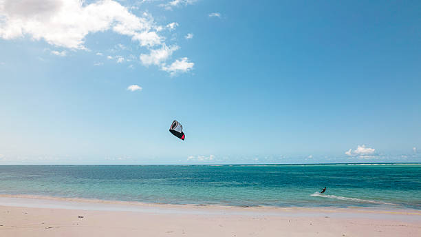 istock A windsurfer gliding through the wind on a beach in Zanzibar 2221809869