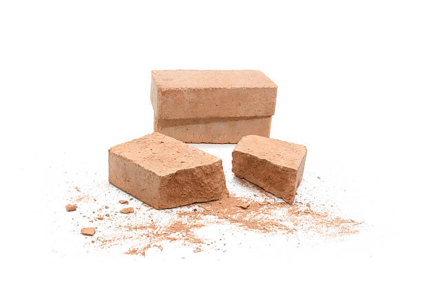 istock Close-up of shattered brick pieces isolated on a white background 2221810249