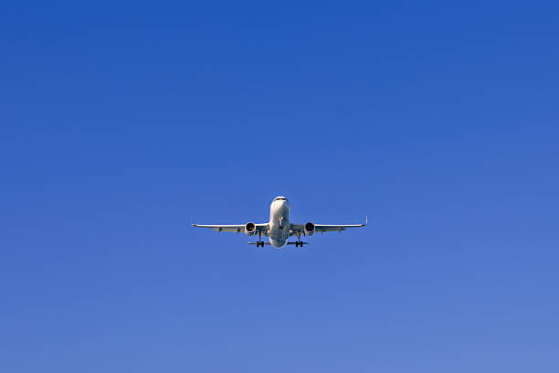 istock Passenger plane flying on a blue sunny sky 2221810887