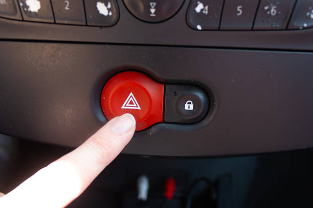 car interior, car, emergency lights in a car, a person's hand presses the emergency lights button, accident, driver