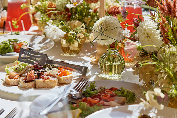 istock Graceful chambers table setting, arranged flowers under shadows. Wedding imbued with the elegance of Provence. 2221815226