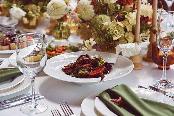 istock Aesthetic stylish autumn table setting, arranged flowers and candles under natural light. Cozy holidays table setup 2221815227