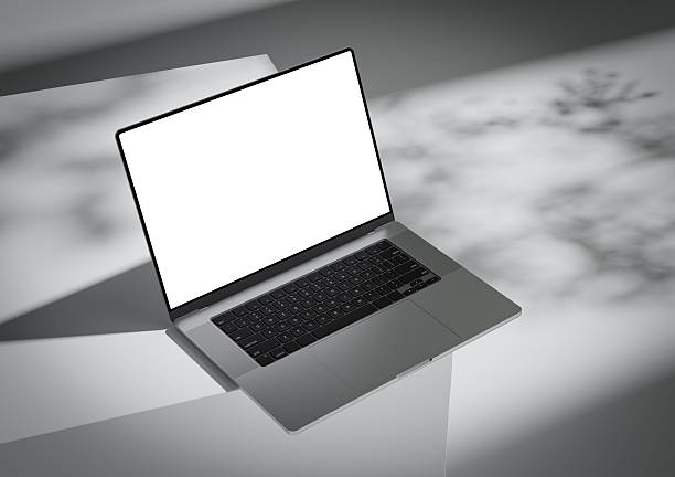 istock A laptop with a blank screen stands on the corner of a box-like surface 2221815861