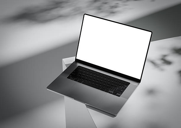 istock A laptop with a blank screen stands on the corner of a box-like surface 2221816372