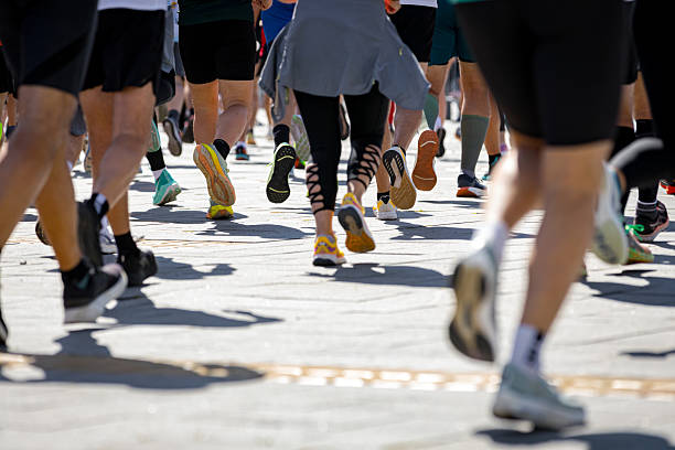istock Large group of athletes running marathon 2221816883