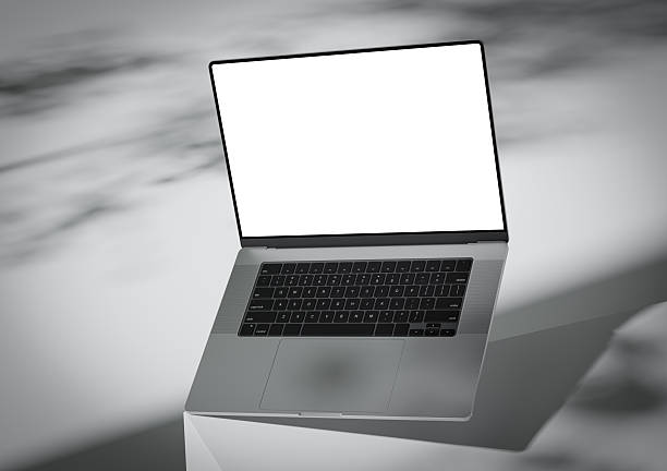 istock A laptop with a blank screen stands on the corner of a box-like surface 2221817440