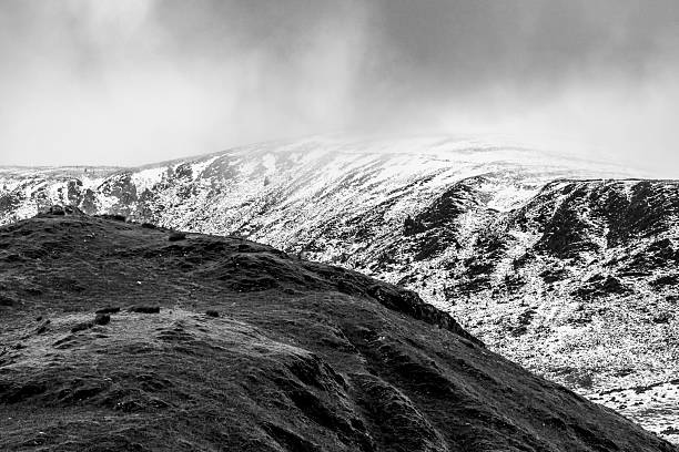 Moody Winter mountainous landscape view in monotone