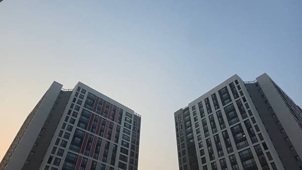 Symmetrical Modern Apartment Towers under Twilight Sky