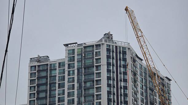 High-Rise Residential Building Under Construction with Tower Crane