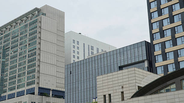 istock Overlapping modern city buildings with mixed textures and geometry 2221820795