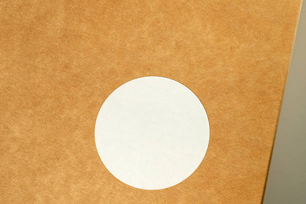 istock Round white circle on textured brown surface close-up 2221820829
