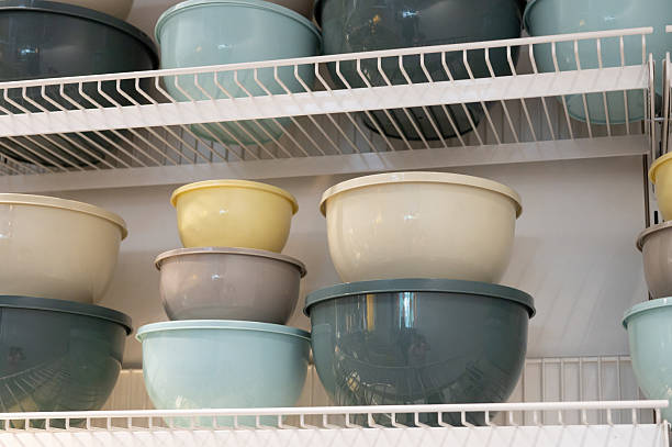 istock Assorted stacked mixing bowls on metal shelves in kitchen storage 2221820834