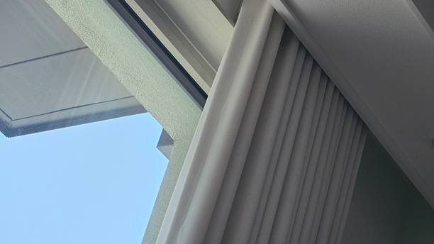Modern window and pleated curtain viewed from below