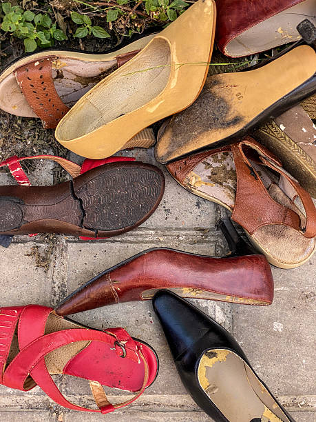 Abandoned women shoes on the sidewalk