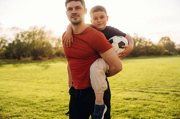 istock Father and son are having fun outdoors 2221825630