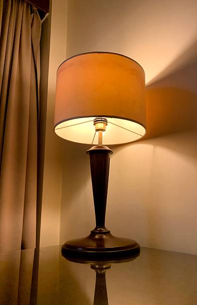 istock Portrait of a lit night light on a table in a hotel. 2221829700