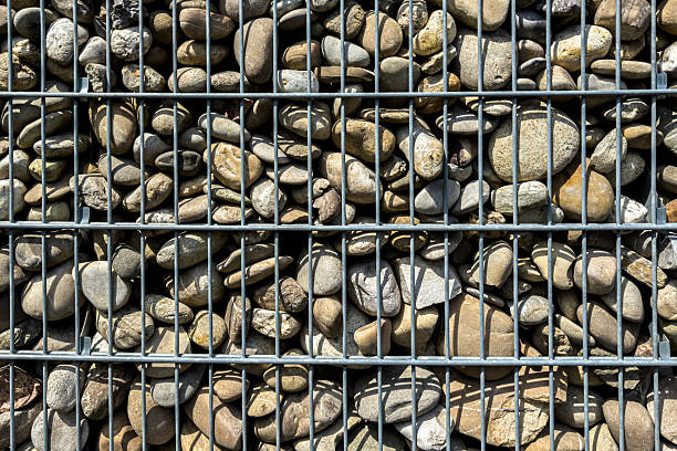 istock Pebbles arranged in a metal grid for landscaping purposes 2221830441