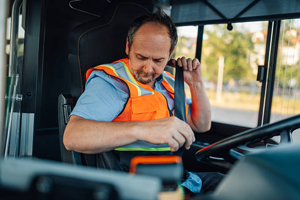 istock Bus driver fastening seat belt before starting route 2221831506