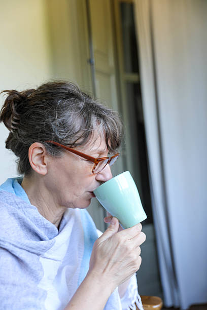 istock Thoughtful Middle-Aged Woman Enjoying Morning Coffee 2221832842